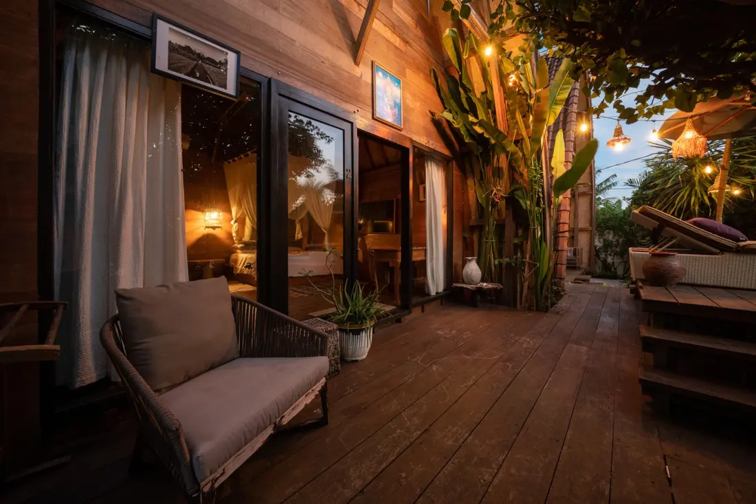 Wooden bungalow and deck at dusk