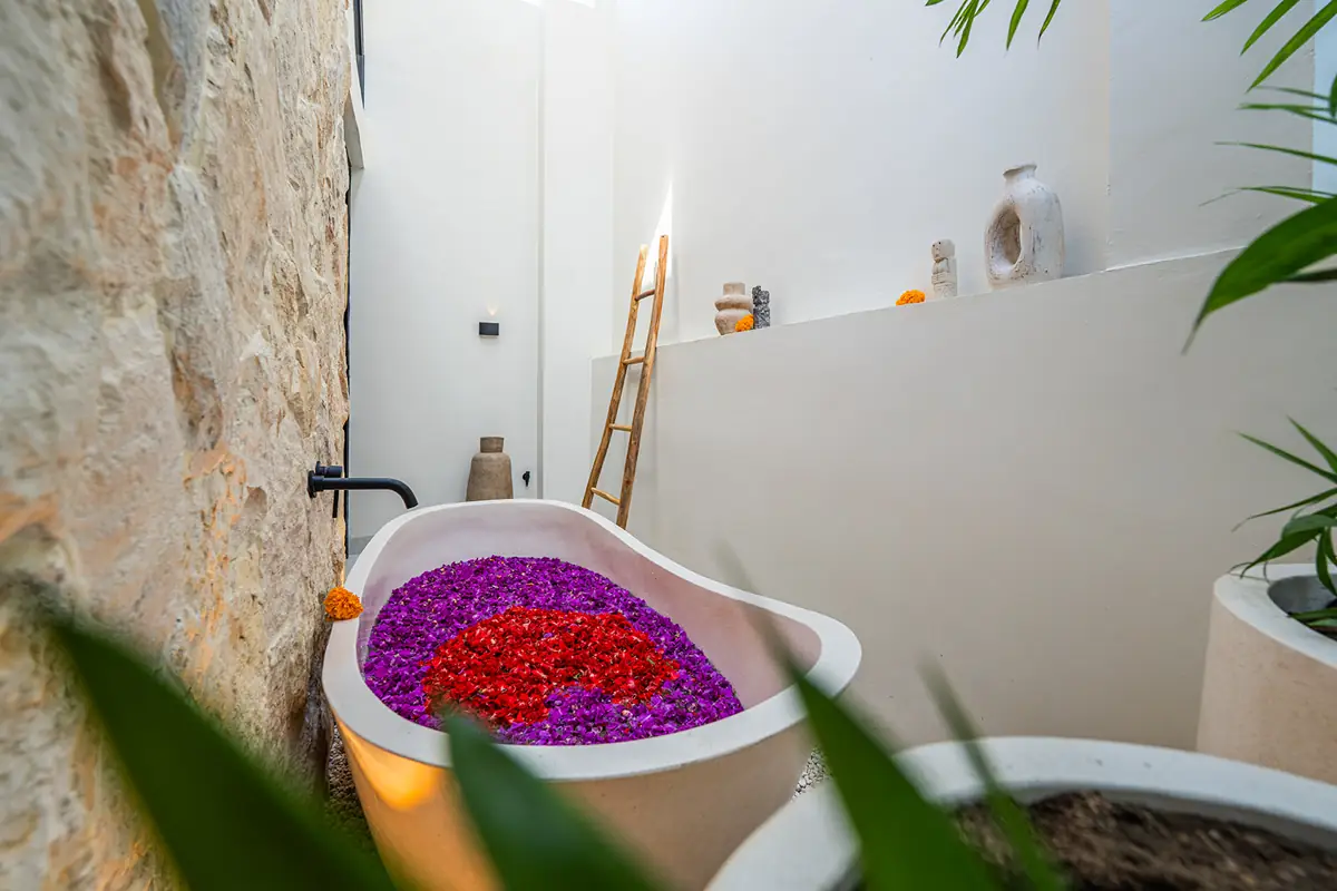 Private villa bath prepared with tropical flowers
